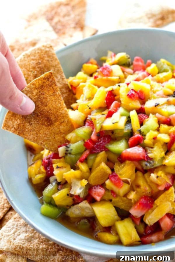 Caramelized Pineapple Salsa with Spiced Cinnamon Chips 7 A close-up shot of the vibrant grilled pineapple fruit salsa with cinnamon chips, highlighting the fresh ingredients and inviting textures.