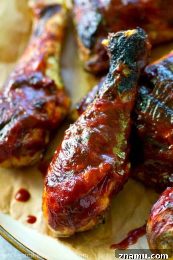 Homemade Grilled BBQ Chicken: A Sizzling Success Story 2 Delicious homemade BBQ chicken smothered in sauce, ready for a summer cookout