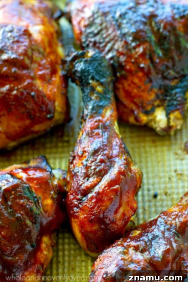 Homemade Grilled BBQ Chicken: A Sizzling Success Story 3 Close-up of perfectly grilled BBQ chicken with a rich, glossy sauce