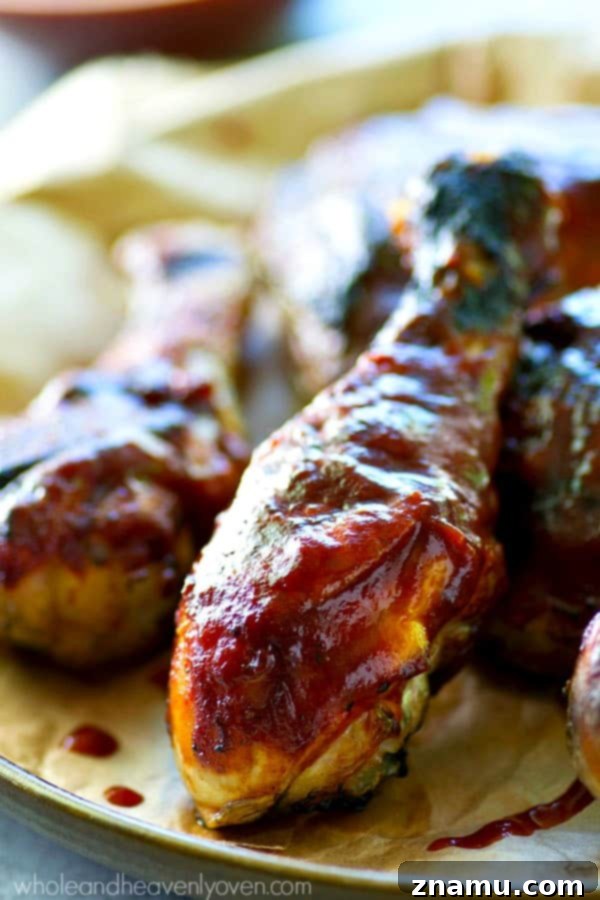 Homemade Grilled BBQ Chicken: A Sizzling Success Story 7 Platter of sticky, saucy homemade BBQ chicken, a perfect messy meal