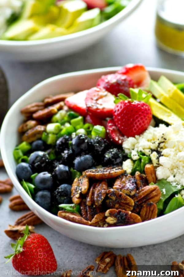 Berry Blast Power Greens with Orange Poppyseed Zest 3 Close-up shot of the fresh berry power salad ingredients, showcasing its colorful appeal.