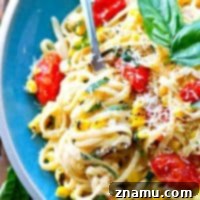 Summer Fettuccine Alfredo with Bursting Tomatoes and Charred Corn 9 Creamy, comforting fettuccine alfredo meets summer! These luscious noodles are piled high with bursting cherry tomatoes, charred corn, and plenty of fresh Parmesan cheese.