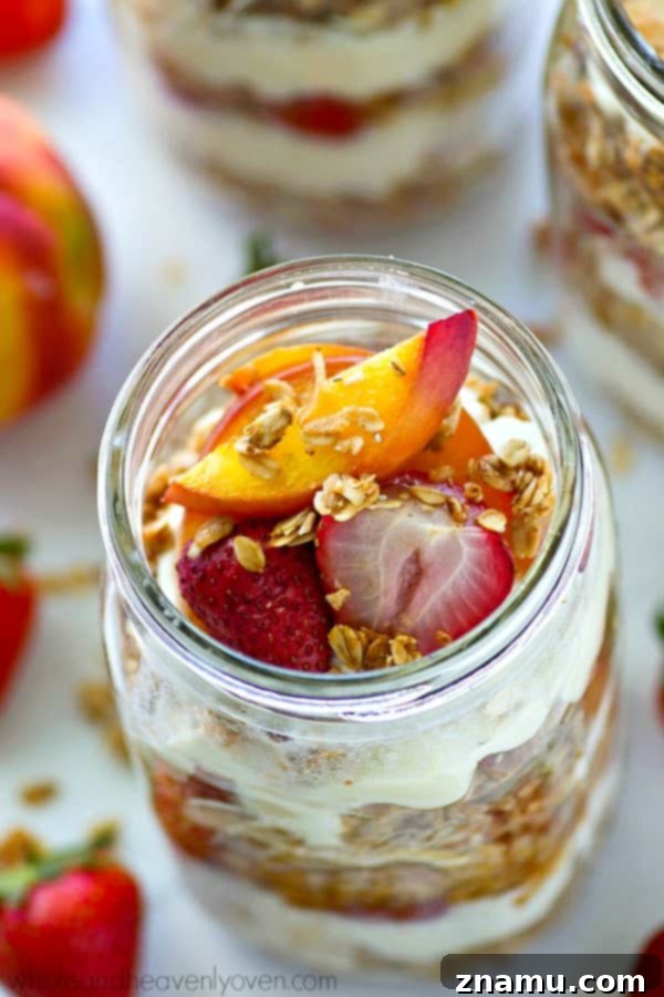 Roasted Peach & Strawberry Granola Parfaits 3 Close-up of a layered Roasted Peach Strawberry Granola Parfait