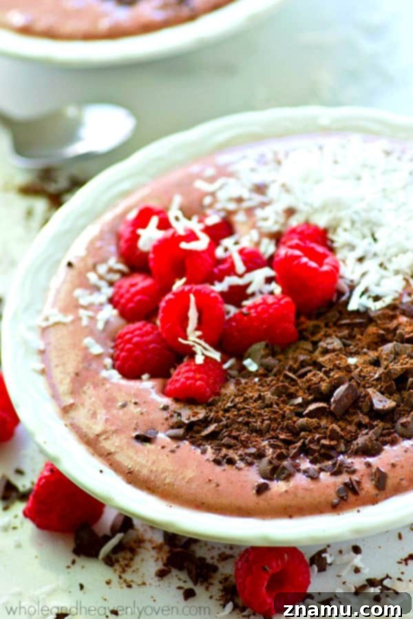 Rich Raspberry Dark Chocolate Smoothie Bowls 2 Delicious raspberry dark chocolate smoothie bowl topped with fresh berries and chocolate shavings