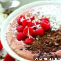 Raspberry Dark Chocolate Smoothie Bowl finished with toppings