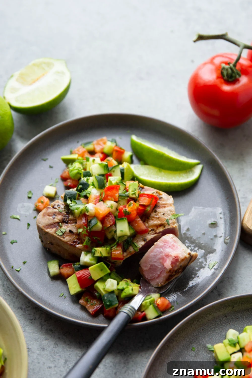 Cilantro-Lime Grilled Tuna with Avocado Cucumber Salsa 2 Cilantro Lime Grilled Tuna steaks are marinated, grilled to perfection, and topped with a fresh avocado cucumber salsa, making it a grilling staple.