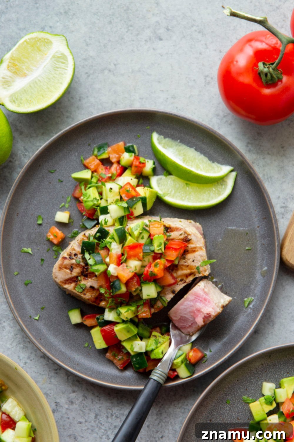 Cilantro-Lime Grilled Tuna with Avocado Cucumber Salsa 3 Grilled Tuna steaks with a vibrant cilantro lime marinade and a generous topping of fresh avocado cucumber salsa.