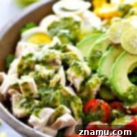 Tons of bountiful summer goodness and an insane homemade basil green goddess dressing transform classic cobb salad into a summertime dream! Load up this gorgeous salad with all your favorites.
