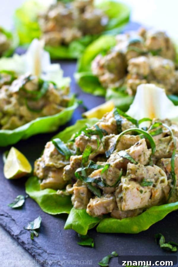 Pesto Grilled Chicken Lettuce Wraps 4 Overhead view of several healthy grilled chicken pesto lettuce wraps arranged on a serving plate.