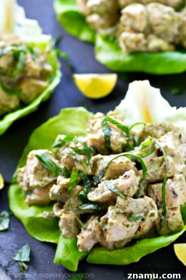 Pesto Grilled Chicken Lettuce Wraps 7 A close-up shot of a finished grilled chicken pesto lettuce wrap, ready to eat.