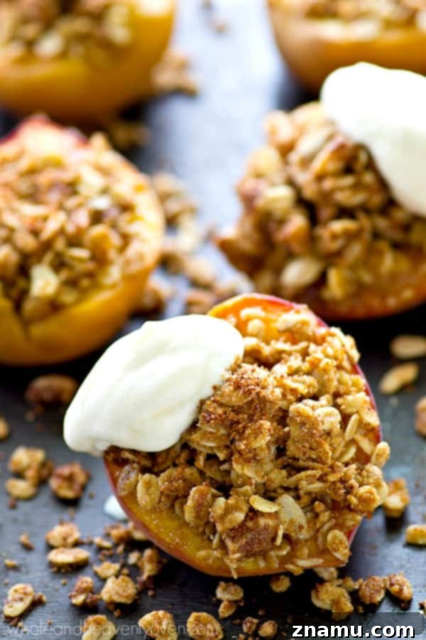 Golden Baked Peaches with a Sweet Pecan-Oat Crumble 2 Two halves of golden-brown baked peaches overflowing with oatmeal pecan streusel, garnished with fresh whipped cream and a sprinkle of cinnamon.