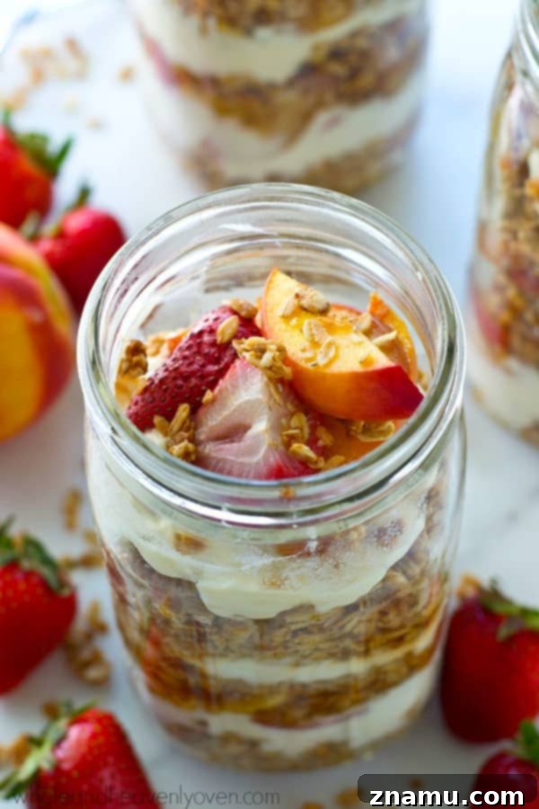 Golden Baked Peaches with a Sweet Pecan-Oat Crumble 11 Beautifully layered Roasted Peach and Strawberry Granola Parfaits, featuring sweet roasted fruits, creamy vanilla yogurt, and crunchy granola for an easy, impressive breakfast or healthy snack.