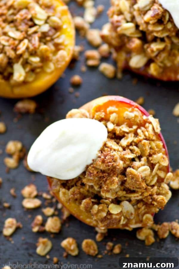 Golden Baked Peaches with a Sweet Pecan-Oat Crumble 3 Close-up shot of a baked peach half, showcasing its golden-brown streusel topping and caramelized edges, ready to be served.