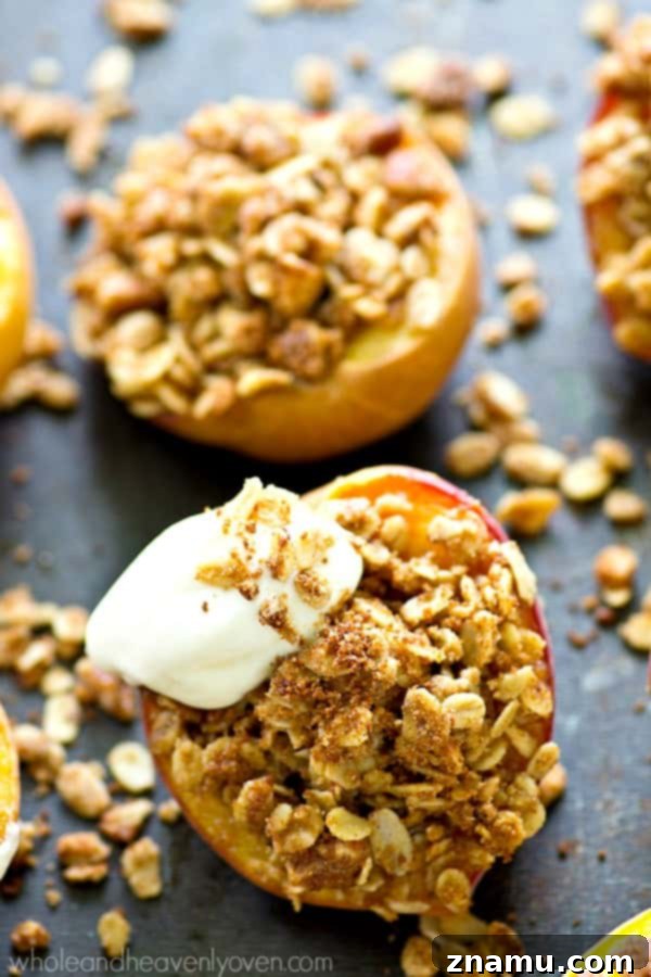 Golden Baked Peaches with a Sweet Pecan-Oat Crumble 4 Several baked peach halves are artfully arranged on a serving plate, highlighting the rich streusel filling and readiness for toppings.