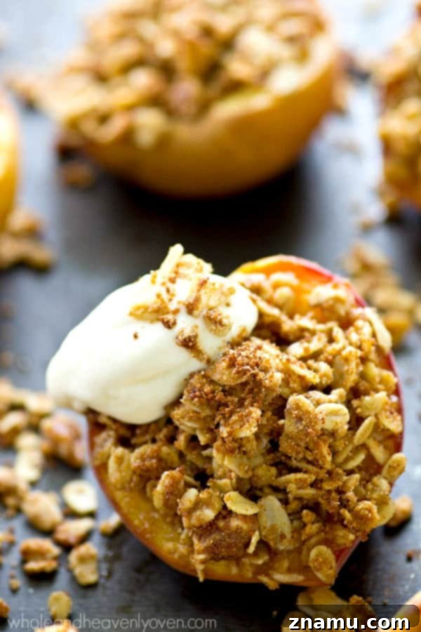 Golden Baked Peaches with a Sweet Pecan-Oat Crumble 5 A close-up of a prepared peach half, filled generously with the uncooked oatmeal pecan streusel, ready for baking.