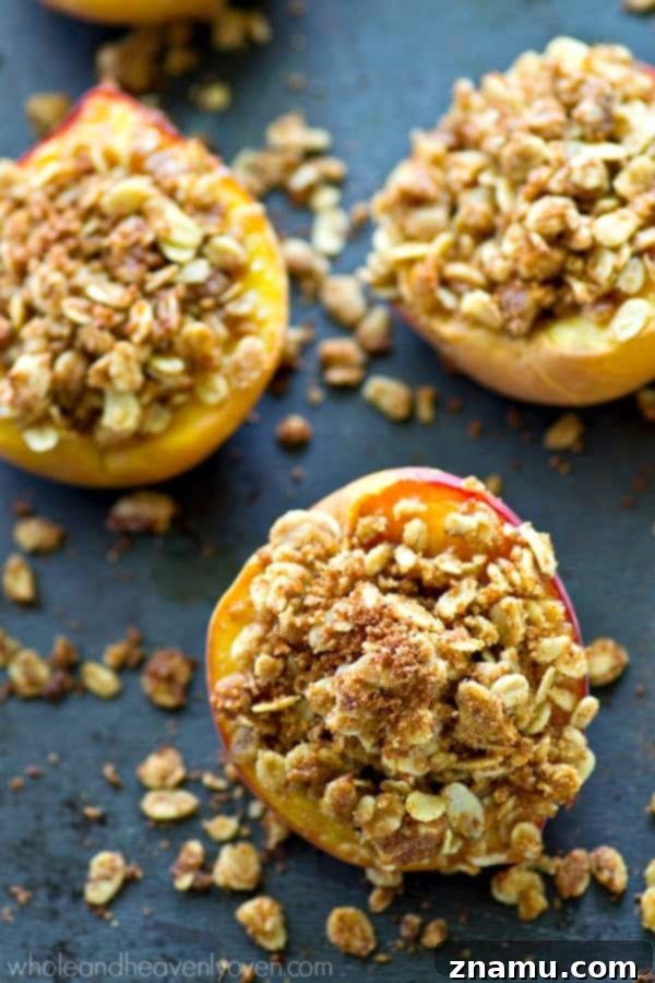 Golden Baked Peaches with a Sweet Pecan-Oat Crumble 6 A single baked peach half, perfectly golden, glistening with melted streusel, and emitting steam, signaling its warmth.