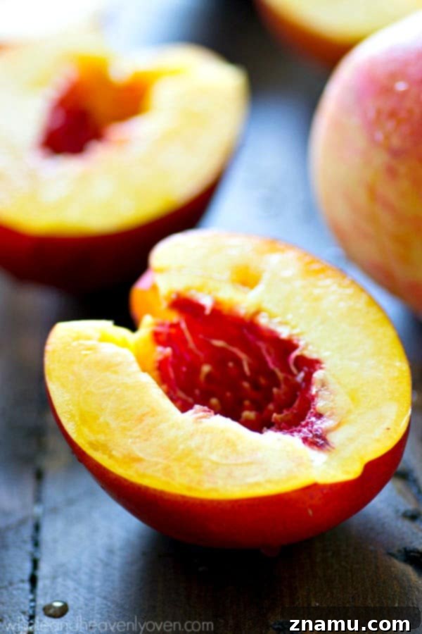 A beautifully plated granola yogurt bowl, showcasing the vibrant colors of peaches and bananas.
