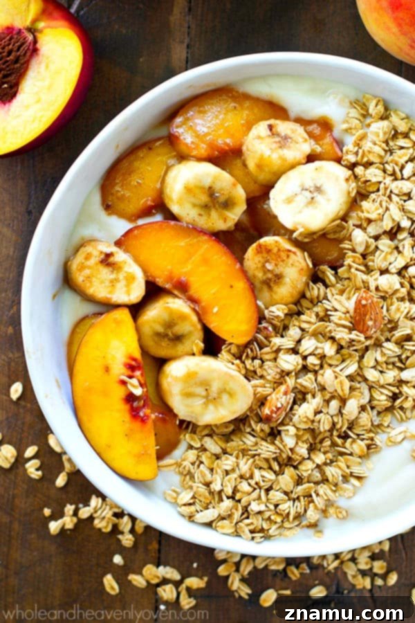 Multiple granola yogurt bowls prepared with caramelized fruit and ready for serving.