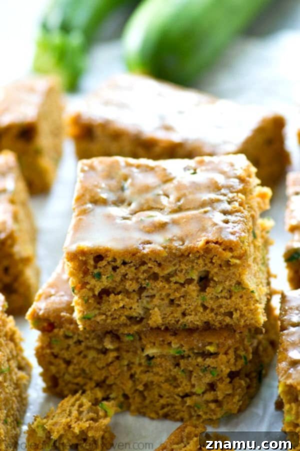 Moist Zucchini Sheet Cake with Tropical Pineapple Glaze 2 Deliciously soft zucchini sheet cake with a tangy pineapple glaze, perfect for a healthy summer dessert.