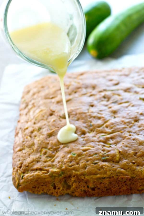 Moist Zucchini Sheet Cake with Tropical Pineapple Glaze 5 A beautifully glazed zucchini sheet cake, perfectly set and ready to be portioned into squares.