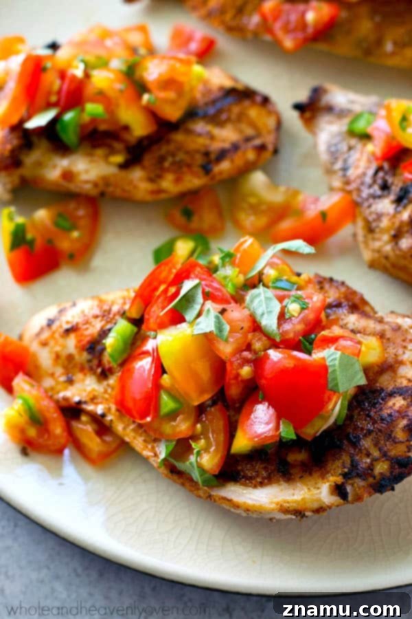 Fiesta Grilled Chicken with Fresh Salsa 3 Close-up of grilled chicken with cumin rub, showcasing its delicious texture and vibrant spice blend.