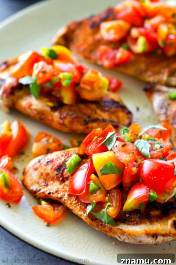 Fiesta Grilled Chicken with Fresh Salsa 4 Grilled chicken breasts getting a generous topping of homemade fresh tomato salsa.