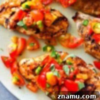 Fiesta Grilled Chicken with Fresh Salsa 9 Juicy grilled chicken breasts get rubbed with a zippy cumin spice mix and topped with tons of fresh garden tomato salsa!---An easy summer dinner in less than 20 minutes.