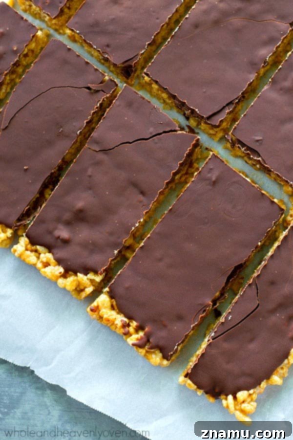 No-Bake Chocolate Cashew Butter Crunch Bars 3 Close-up of healthy no-bake rice krispie treats with chocolate topping.