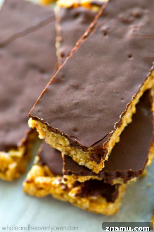 No-Bake Chocolate Cashew Butter Crunch Bars 7 Healthy no-bake rice krispie treats, cut into squares, on a wire rack.