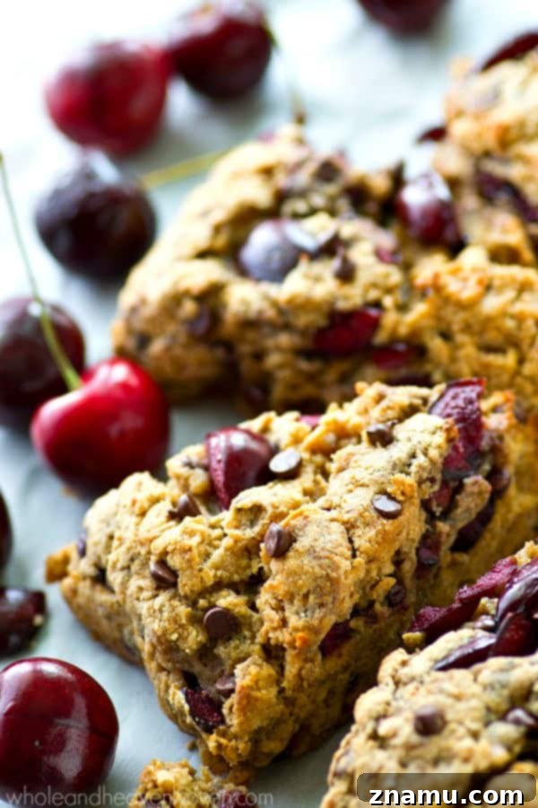 Luscious Cherry Chocolate Coconut Scones 7 Freshly baked cherry chocolate chip scones cooling on a rack.