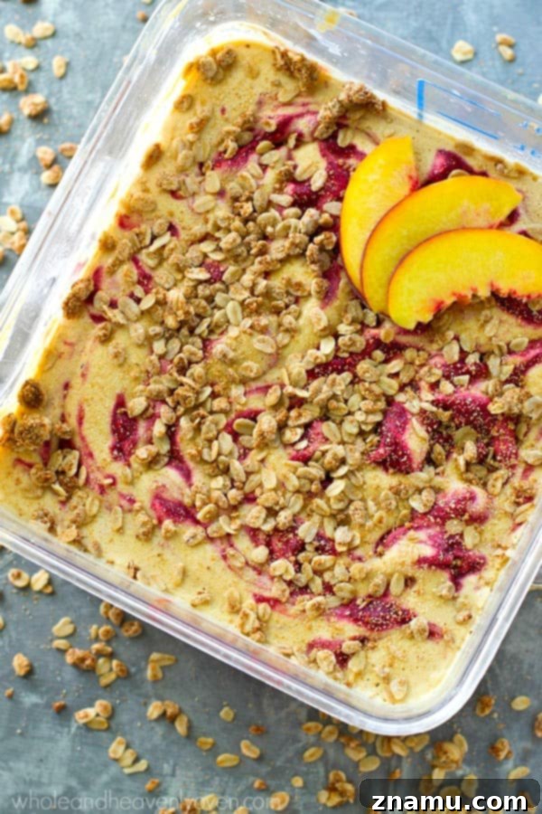 Golden Peach Crumble & Raspberry Ripple Ice Cream 5 Scoops of peach ice cream adorned with a delicate raspberry swirl, emphasizing the fresh fruit ingredients