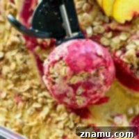 Golden Peach Crumble & Raspberry Ripple Ice Cream 9 This fresh peach ice cream is swirled with a tangy raspberry swirl and piled with tons of cinnamon-sugary oatmeal streusel for a killer end-of-season ice cream you won't want to miss!