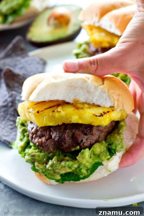 Jerk-Grilled Hamburgers with Avocado and Grilled Pineapple 6 Fresh pineapple rings getting perfectly charred on a grill