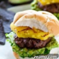 Sweet 'n' spicy jerk-flavored hamburgers with smashed avocado and grilled pineapple
