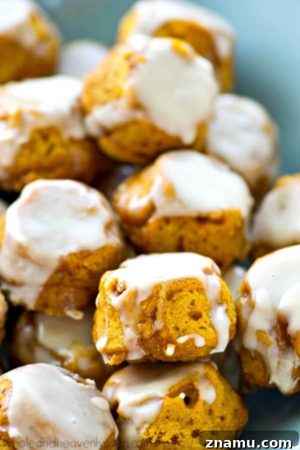 Lighter Pumpkin Spice Glaze Poppers 4 Golden brown pumpkin spice donut holes piled high, ready for glazing.