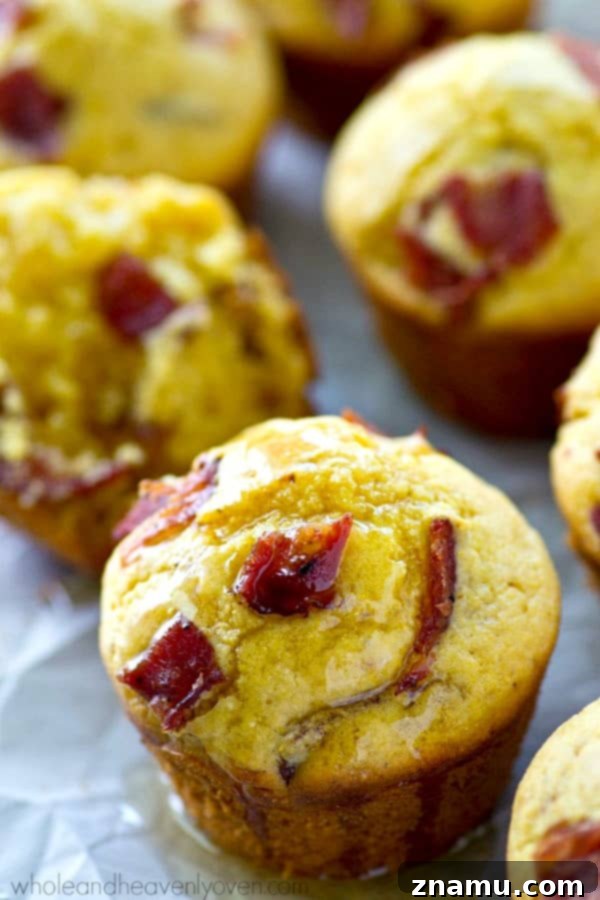 Brown Butter Bacon Cornbread Muffins 5 Unbaked cornbread muffin batter in a mixing bowl, showing the blend of ingredients before baking.