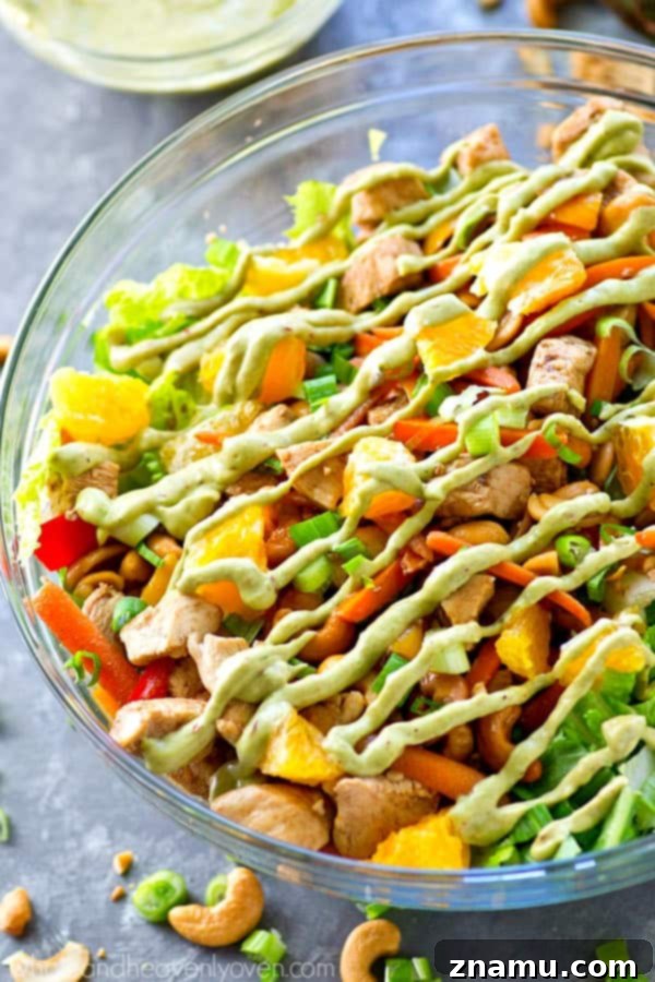 Creamy Chipotle Avocado Cashew Chicken Salad 2 Love cashew chicken? You're going to love it even more in super-healthy salad form with an insane kicked-up chipotle avocado dressing drizzled on top! A colorful cashew chicken salad with creamy chipotle avocado dressing.