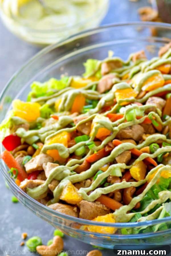 Creamy Chipotle Avocado Cashew Chicken Salad 4 A beautifully presented bowl of cashew chicken salad, highlighting the vibrant colors of the ingredients and the rich texture of the chicken and nuts.
