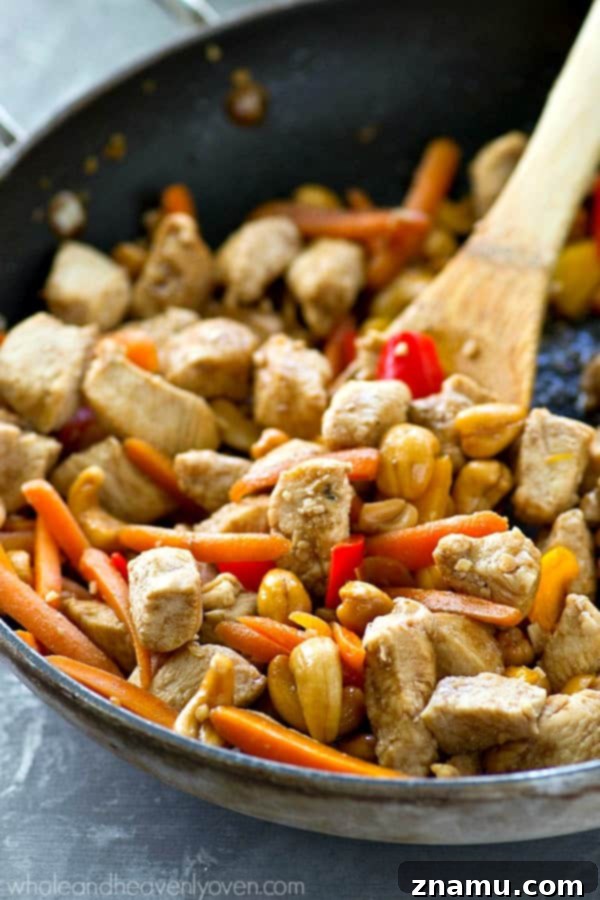 Creamy Chipotle Avocado Cashew Chicken Salad 5 Ingredients for the cashew chicken stir-fry laid out, including diced chicken, red pepper, carrots, and garlic, ready for cooking.