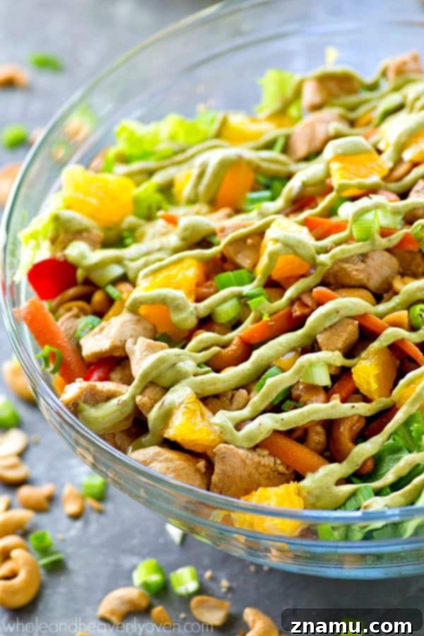 Creamy Chipotle Avocado Cashew Chicken Salad 7 A vibrant bowl of Cashew Chicken Salad with Chipotle Avocado Dressing, showcasing the rich colors and textures of the ingredients.