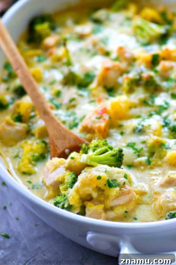 Golden Three-Cheese Chicken and Broccoli Spaghetti Squash Bake 4 Prepared spaghetti squash strands, resembling noodles, placed in a large mixing bowl.