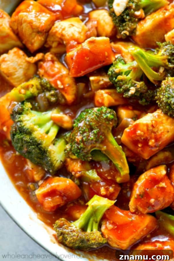 BBQ Chicken and Broccoli Rice Skillet 3 Close-up of a sizzling skillet with BBQ chicken and tender broccoli