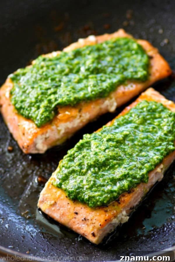 Perfectly Seared Salmon with Spinach Basil Pesto 4 Ingredients for homemade spinach basil pesto laid out, including fresh spinach, basil, pine nuts, garlic, and lime.