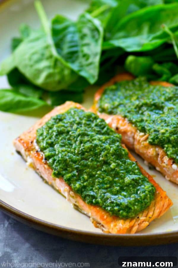 Perfectly Seared Salmon with Spinach Basil Pesto 5 Bowl of freshly made green spinach basil pesto sauce, showcasing its vibrant color and smooth texture.