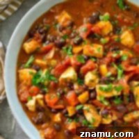Smoky Hearty Slow Cooker Chipotle Chicken Chili 9 Fill up the crockpot for your next football party with this kickin' chipotle chicken chili! Everything gets dumped in the crockpot for easy prep and you won't BELIEVE all the amazing cozy flavors packed inside.