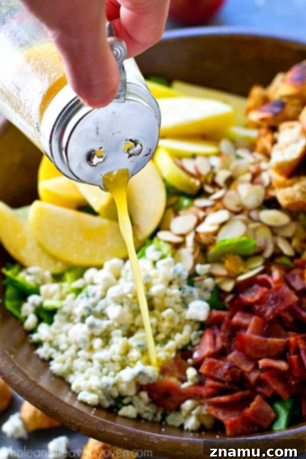 Vibrant Apple Almond Blue Cheese Salad with Zesty Cider Dressing 7 A generous serving of fall-style apple salad, highlighting its rich textures and colors
