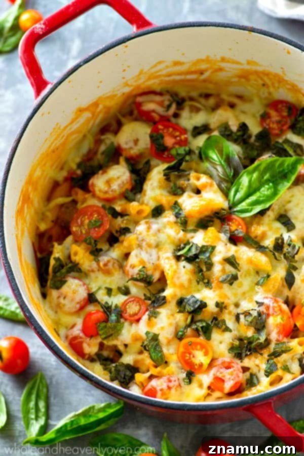 Basil Sausage Caprese Skillet Pasta 2 Delicious one-pot caprese pasta with fresh basil, cherry tomatoes, and melted mozzarella cheese, ready in 30 minutes for an easy weeknight meal.