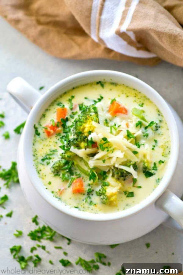 Wholesome Slow Cooker Broccoli Cheddar Soup 5 Vegetables simmering in chicken broth in a slow cooker, a key step for the broccoli cheese soup.