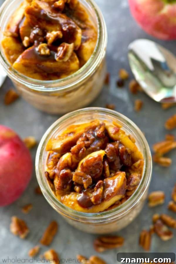 Delicious Caramelized Apple Cinnamon Roll Overnight Oats in a glass jar, perfect for an autumn breakfast.