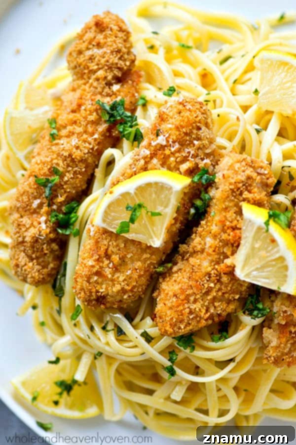 Crispy Lemon Parmesan Chicken Tenders with Aromatic Herb Pasta 3 Crispy lemon Parmesan baked chicken strips and buttery herb noodles make for one unbelievably fast and easy, yet totally insanely flavorful dinner that everyone will gladly gobble up!